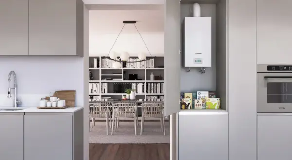 Calentador estanco blanco instalado en un armario de cocina moderno, junto a un horno.