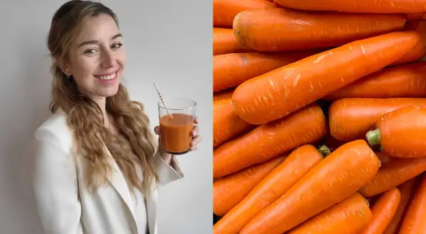 Frau mit Karottensaft und ein Haufen Karotten. Sie genießt jeden Tag eine Karotte für ihre Gesundheit.