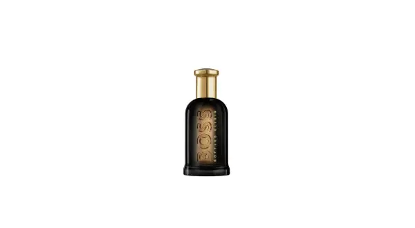 Elegancka butelka perfum Hugo Boss Bottled Oud Elixir z ciemnego szkła i złotym korkiem.