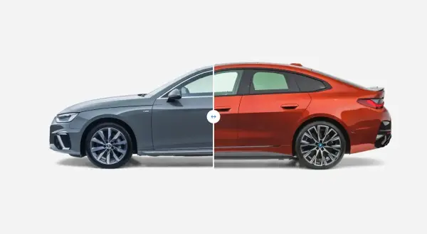 Porównanie wymiarów samochodów osobowych: szare Audi i pomarańczowe BMW.