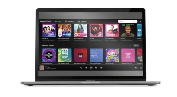 Laptop z interfejsem Amazon Music Unlimited. Widoczne playlisty: "All Hits UK", "Pop Right Now", "My Discovery Mix" i "Feel-Good 00s Hits".