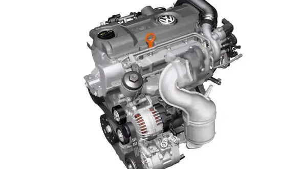 Silnik Volkswagen TDI z turbosprężarką i alternatorem, gotowy do pracy.