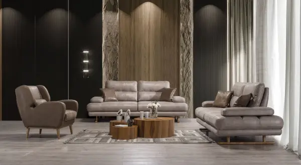 Modern vardagsrum med grå lädersoffa och fåtölj. Perfekt soffa inspiration för ett stilrent hem.