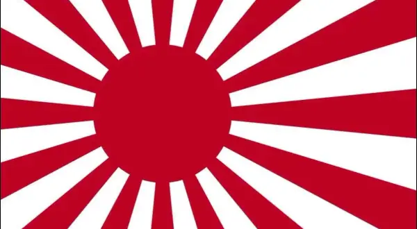 Flaga Japonii z czerwonym słońcem i promieniami.