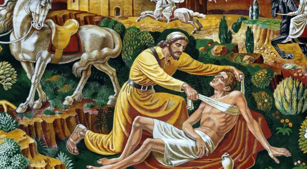 Miłosierny Samarytanin opatruje rannego. Obok stoi koń, w tle widać zamek i innych podróżnych.