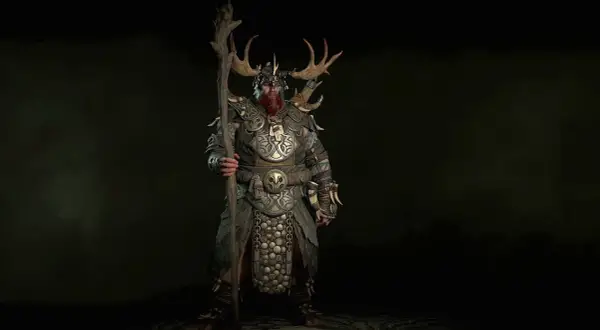 Potężny diablo 2 druid w zbroi z rogami jelenia, trzymający kostur.