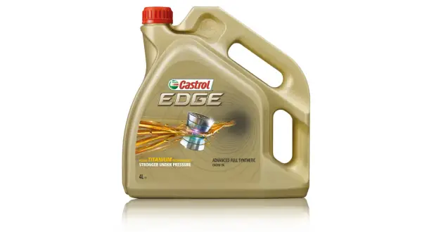 Złoty kanister oleju silnikowego Castrol EDGE z czerwonym korkiem i grafiką.