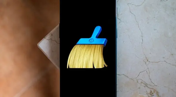 Un teléfono muestra el icono de una escoba azul y amarilla, símbolo del mejor limpiador de móvil gratis.