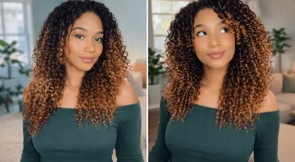 Jeune femme avec de magnifiques cheveux fins bouclés, dégradé de brun à blond miel, portant un haut vert émeraude.