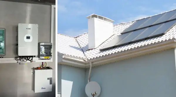 Instalacja fotowoltaiczna z panelem słonecznym na dachu i bank energii zamontowany na ścianie.