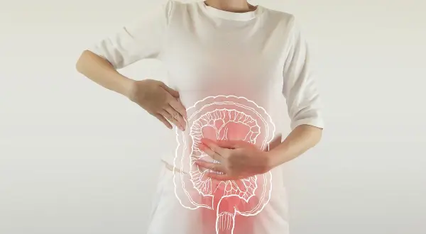 Kobieta z bólem brzucha, ilustracja jelit. Może to symbolizować problemy z trawieniem lub inkontynencję kałową.