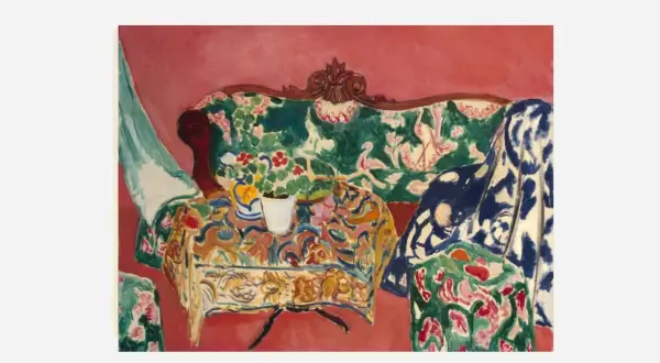 A vibrant interior scene by Matisse, capturing the joy of life with a floral sofa, patterned tablecloth, and a vase of flowers.