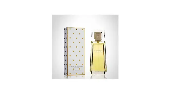 Eleganckie perfumy Carolina Herrera w złotym flakonie i pudełku w kropki.
