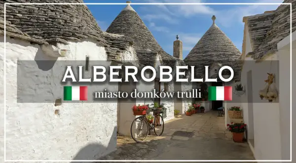 Urokliwe domki trulli w Alberobello, Włochy. Rower z kwiatami czeka na przejażdżkę po urokliwych uliczkach.
