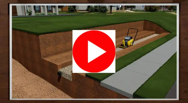 Construcción de un muro de contención con compactadora. Se ve la excavación, drenaje y preparación del terreno para un jardín y acera.