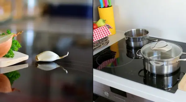 Cebula i czosnek na płycie ceramicznej czy indukcyjnej, obok garnków i koszyka z warzywami.
