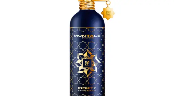 Granatowa butelka perfum Montale Infinity z złotymi zdobieniami i zawieszką.