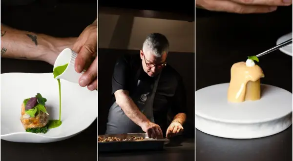 Chef en un restaurante estrella Michelin prepara un plato con esmero. La cocina de autor se refleja en cada detalle.