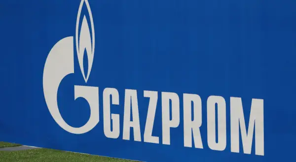 Gazprom-Logo auf blauem Hintergrund, das an russische ADR-Aktien erinnert.
