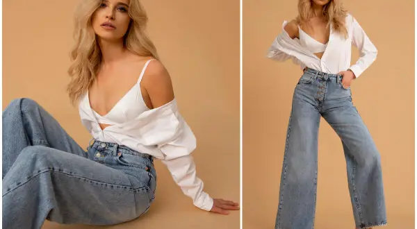 Modne szerokie jeansy i biały top to styl, który jest teraz modny.