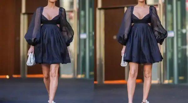 Elegancka czarna sukienka z bufiastymi rękawami i wycięciami. Idealna stylizacja na 40 urodziny, by poczuć się wyjątkowo.