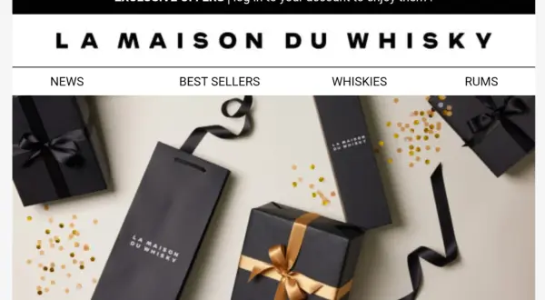 Eleganckie czarne opakowania z logo "La Maison du Whisky" i złotymi wstążkami, otoczone konfetti. Idealne na prezent dla miłośnika whisky.