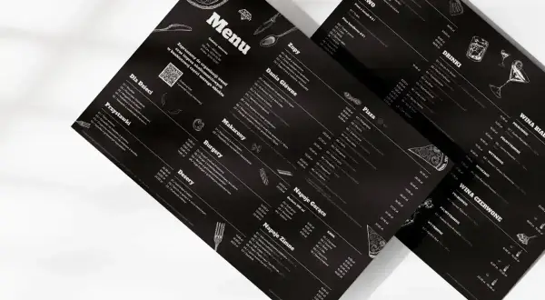 Menu z czarnym tłem, prezentujące ofertę a la carte. Widoczne sekcje: Zupy, Dania Główne, Pizza, Makaron, Burgery, Desery, Napoje Gorące i Zimne, Piwo, Drink, Wina.
