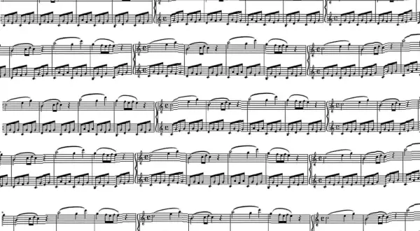 Un complesso spartito musicale per pianoforte, con note e pentagrammi che si susseguono in un flusso continuo di melodia.