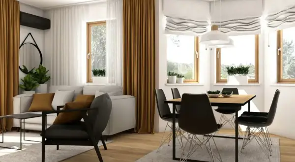 Nowoczesny salon z jadalnią. Stół w salonie inspiracje: drewniany blat, czarne krzesła, jasna kanapa, złote zasłony.