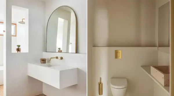 Salle de bain moderne avec lavabo flottant, miroir arche et WC suspendu. Une belle deco wc petit espace avec des touches dorées.
