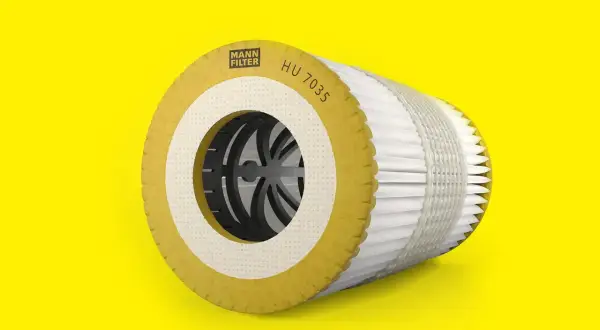 Mann Filter Ölfilter-Kartusche HU 7035 auf gelbem Hintergrund.
