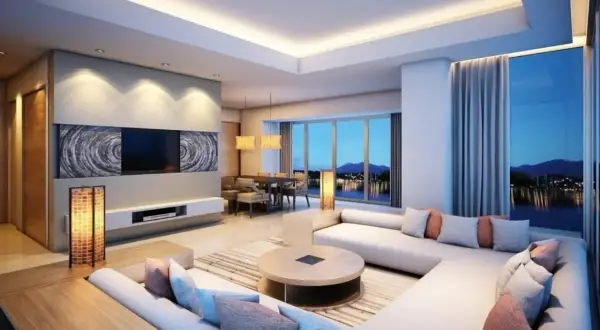 Illuminazione a led integrata in un controsoffitto in cartongesso, che valorizza un salotto moderno con vista lago.