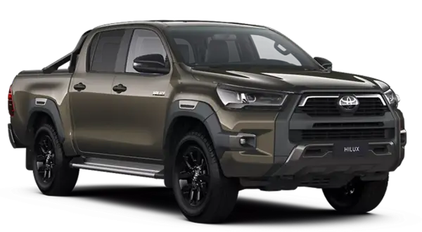 Brązowy Toyota Hilux z czarnymi felgami i relingami. Sprawdź aktualną toyota hilux cena i zamów swój wymarzony samochód.