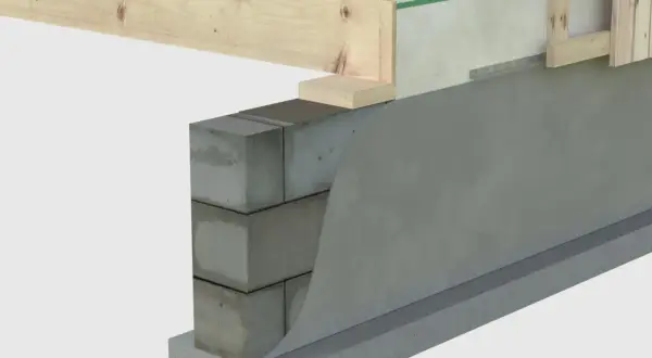 Detaljerad vy av syll på betongplatta med isolering och trästomme.