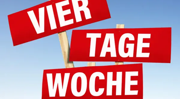 Rote Schilder mit weißen Buchstaben: "VIER TAGE WOCHE". Ein ironisches Bild, wenn man krank am freien Tag ist.