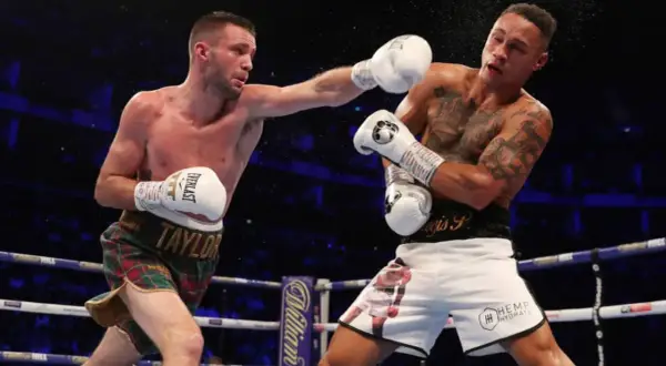 Boxer lands a punch, showcasing the intensity of a middleweight weight limit bout.