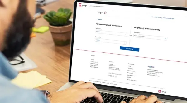 Na ekranie laptopa widzimy stronę logowania do Profilu Zaufanego. Użytkownik szuka swojego Banku Spółdzielczego, aby założyć profil zaufany w Santander.