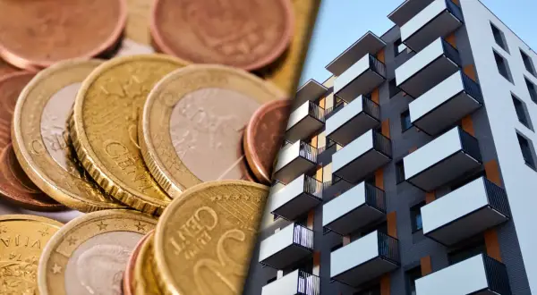 Euro monety i nowoczesny blok mieszkalny. Wpływ stóp procentowych, jak euribor 3m, na rynek nieruchomości.
