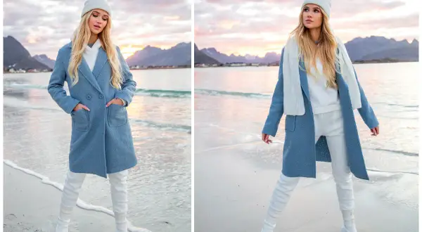 Niebieski płaszcz i białe dodatki tworzą stylowy zestaw na plaży. Modelka prezentuje modne niebieski płaszcz stylizacje.