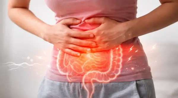 Dolore e tensione addominale con un'illustrazione luminosa dell'intestino.