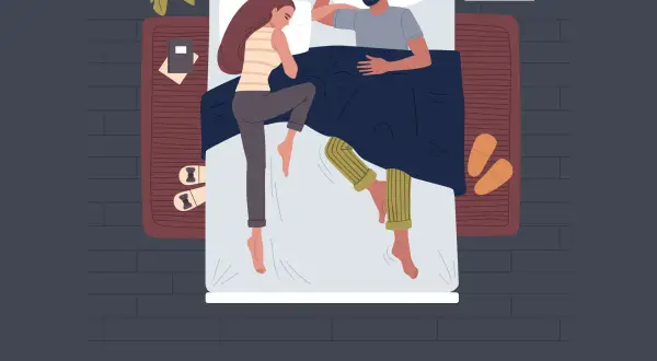 A couple sleeps in bed, illustrating the concept of feng shui sleeping head direction for better rest and harmony.