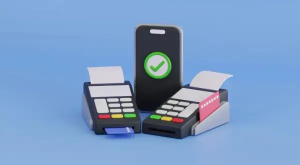 Zwei Kartenlesegeräte und ein Smartphone mit Häkchen-Symbol stehen für bargeldlose Zahlung.
