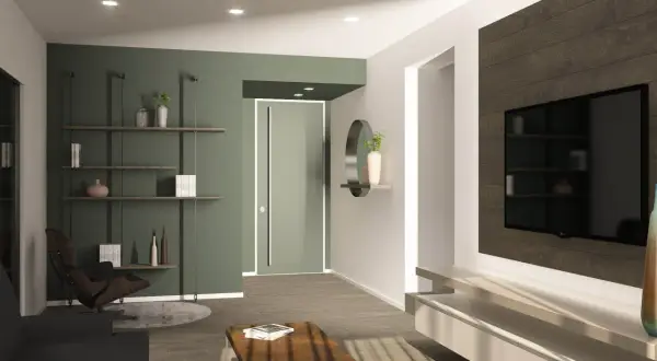 Un soggiorno moderno con parete verde, ideale per chi vuole imparare come tinteggiare una parete. Arredamento minimalista con TV a parete e poltrona di design.
