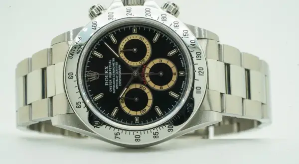 Rolex Daytona watch with black dial and tachymeter bezel.