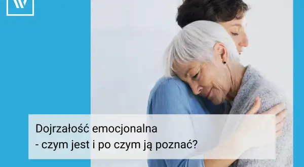 Dwie kobiety w uścisku, symbolizujące dojrzałość emocjonalną i wsparcie.
