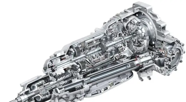 Przekładnia z mechanizmem różnicowym torsen, pokazująca skomplikowane koła zębate i wały napędowe.