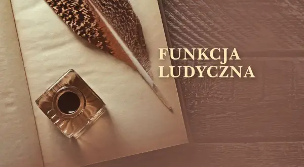 Pióro i kałamarz na otwartej księdze, symbolizujące funkcję ludyczną pisania i tworzenia.
