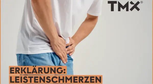 Mann hält sich die Leiste, wo ist die Leiste? Erklärung: Leistenschmerzen. TMX Logo.