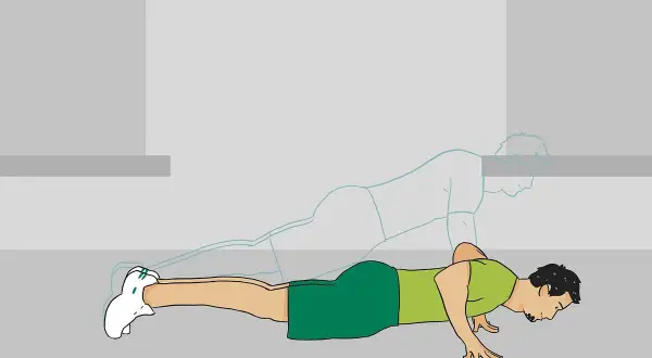 Un homme fait des pompes, ses bras et avant-bras travaillent pour le mouvement.
