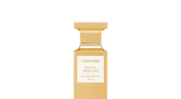 Złota butelka perfum Tom Ford Soleil Brûlant, emanująca ciepłem i luksusem.